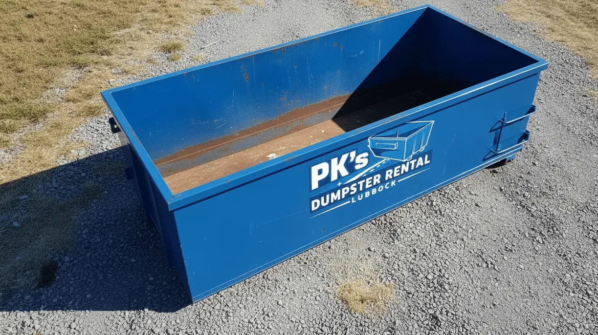 Securing a dumpster load against Lubbock wind — debris capped and kept below the container rails